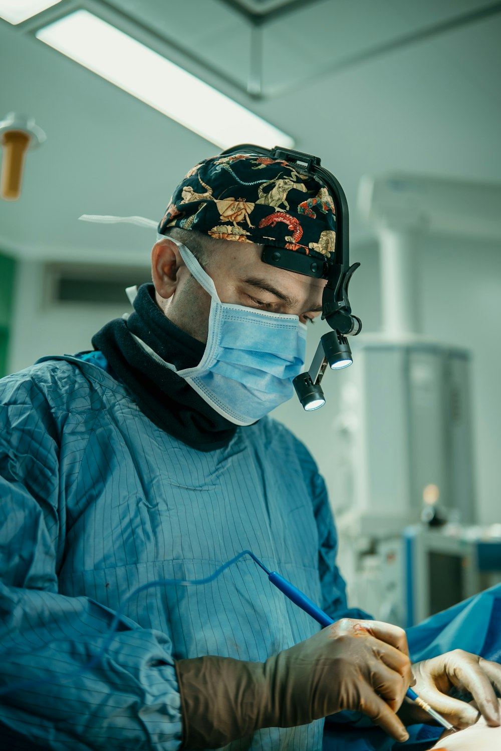 a man in a surgical mask is doing surgery