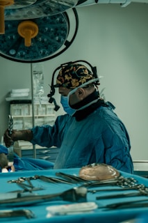 a man in a surgical gown is operating a machine