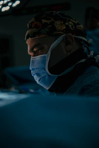 a man wearing a surgical mask in a hospital