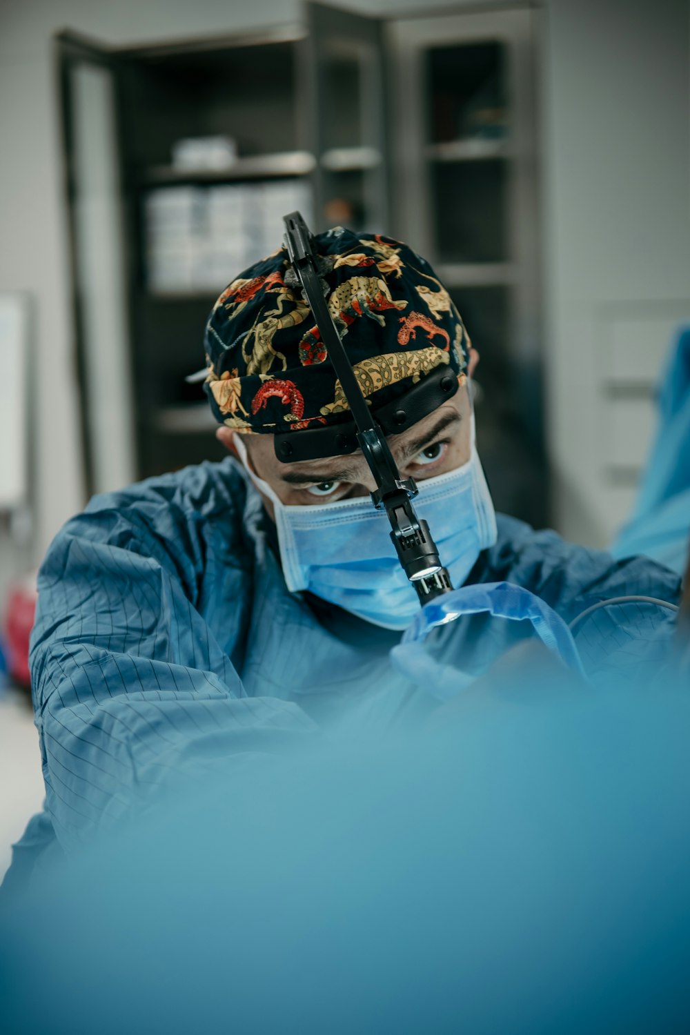 a man wearing a surgical mask and a cap