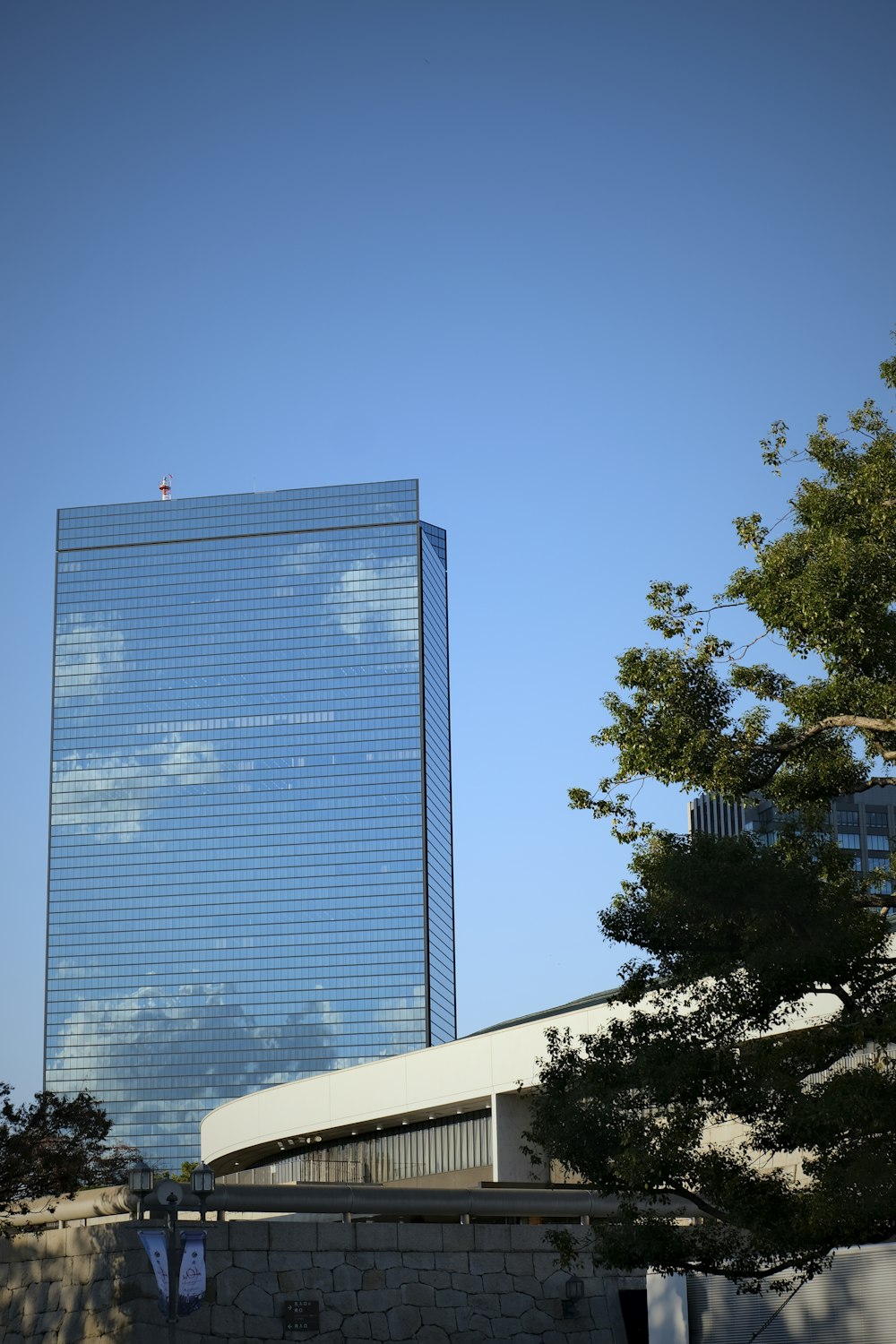 a very tall building with a sky background