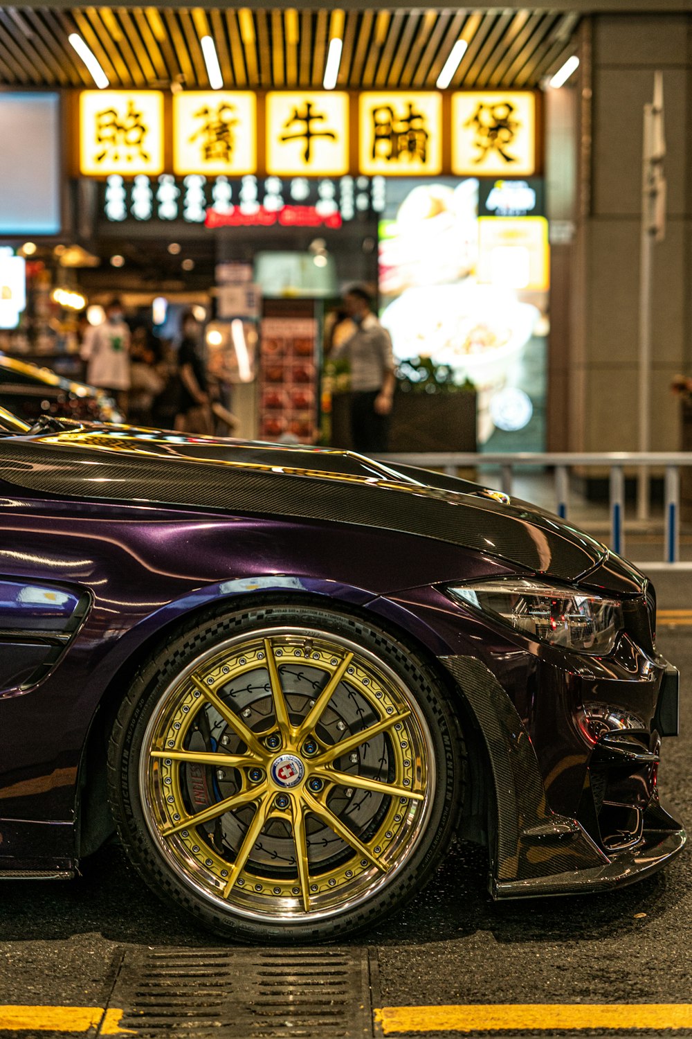 a purple car parked on the side of the road