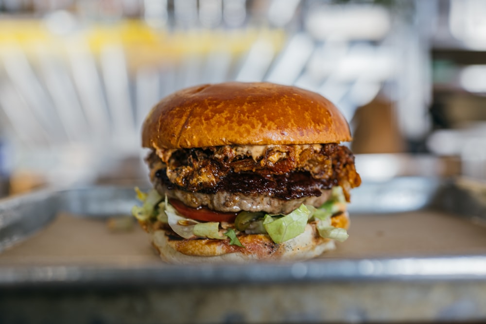 a close up of a burger on a tray