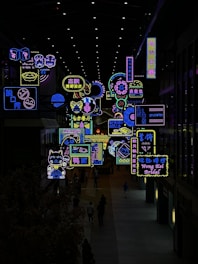 a large display of neon signs in a building