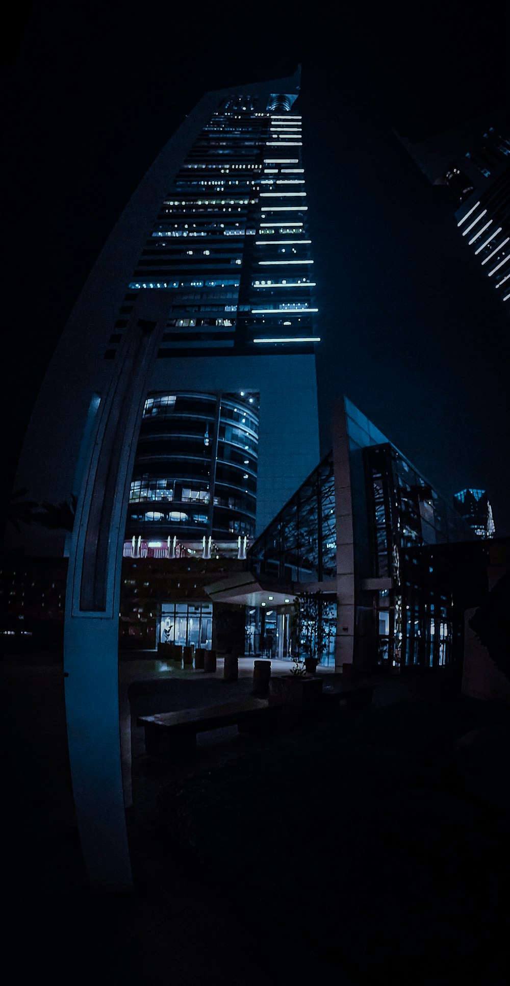 a very tall building in the middle of a city at night