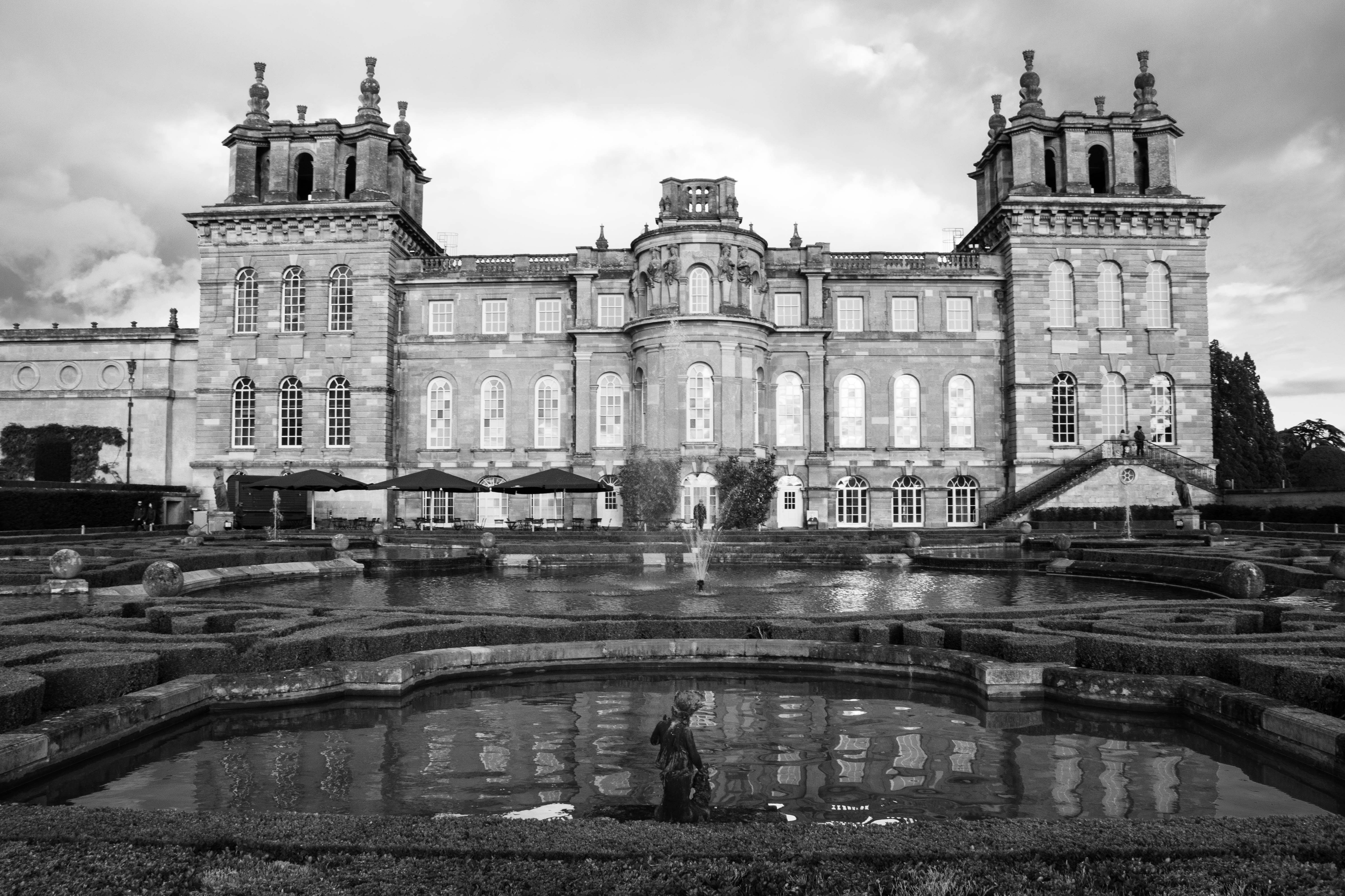 a large building with a fountain in front of it