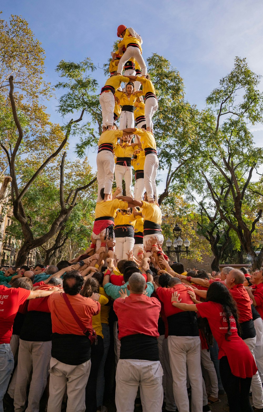 a group of people standing around a large float