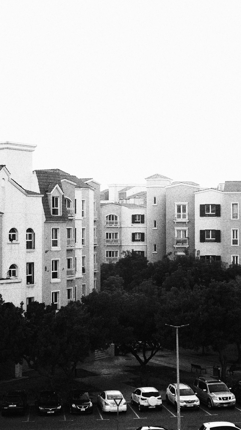 a black and white photo of a parking lot