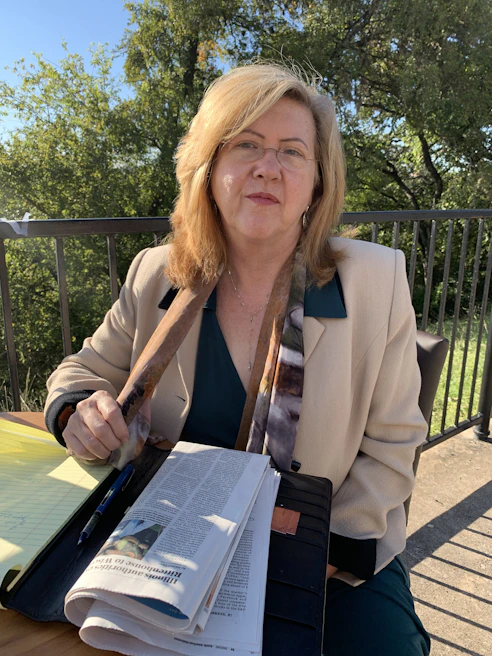 Mobile notary meeting a client outside a Brooklyn law office on a sunny day