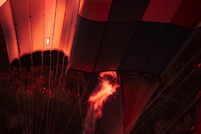 Close-up of a vibrant hot air balloon fabric glowing in the morning light