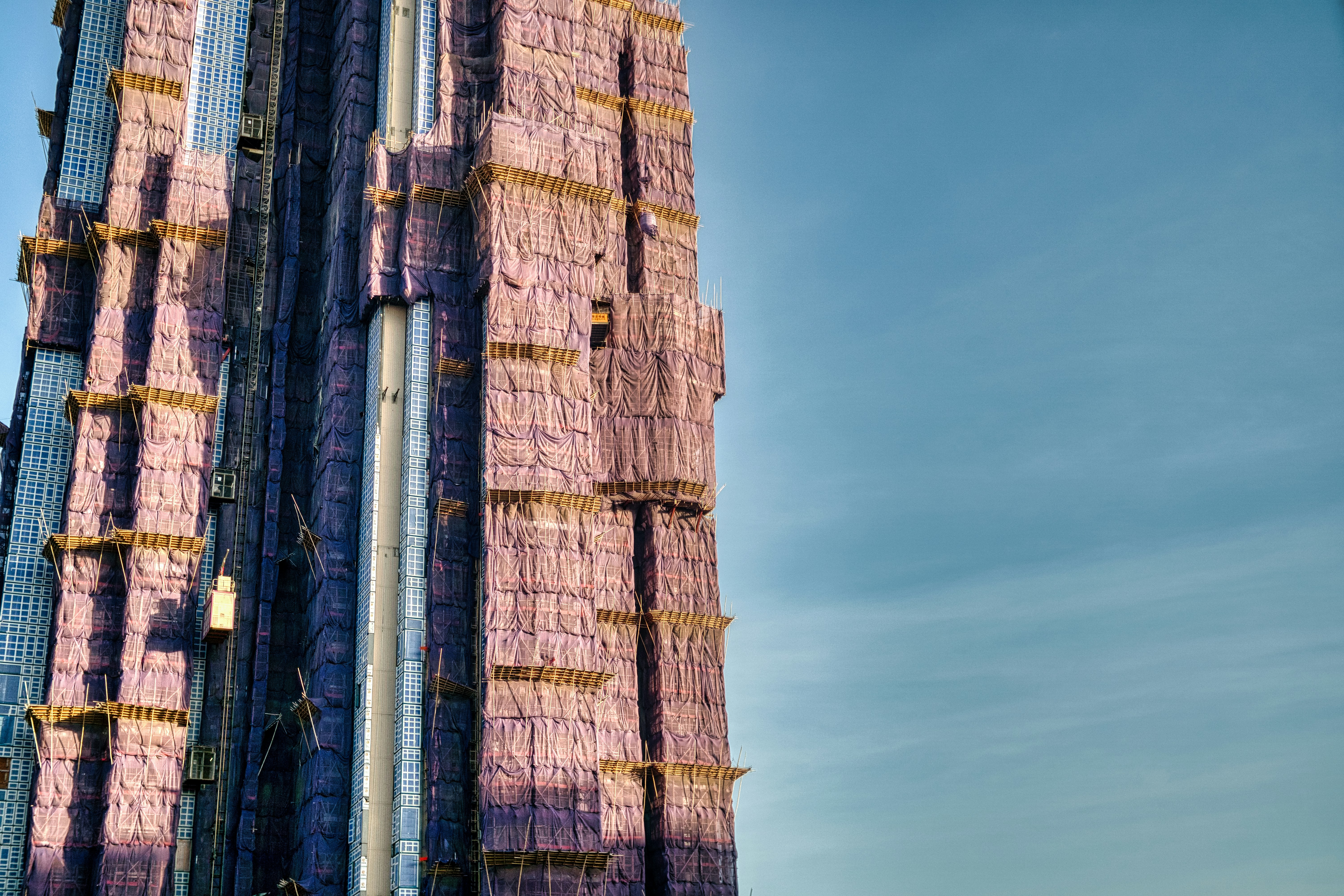 a very tall building with a very tall clock on it's side