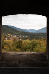 Window view from standard room showing peaceful village scenery.