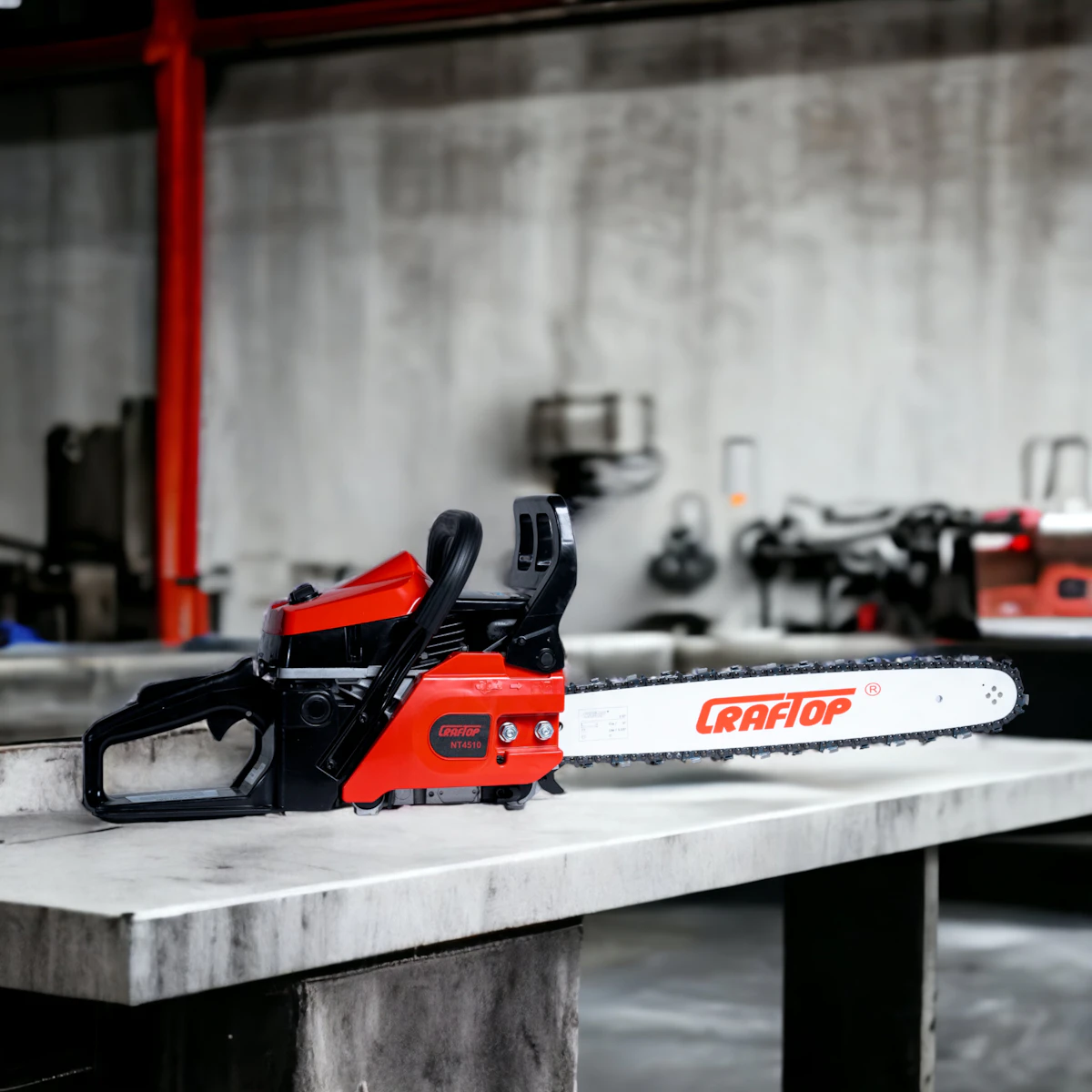 A red and black chainsaw resting on a workbench