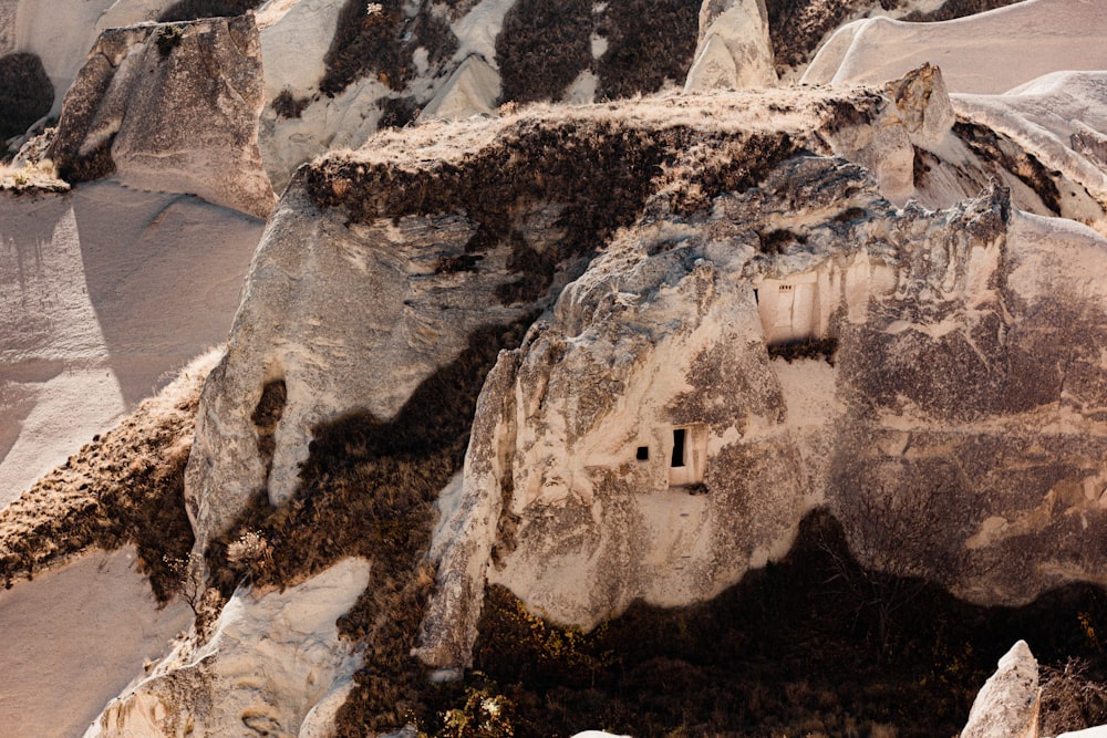 a rock formation with a cave in the middle of it