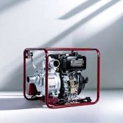 a small red and black engine inside of a red frame