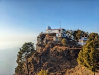 A peaceful temple viewed from the window of a luxury aircraft.
