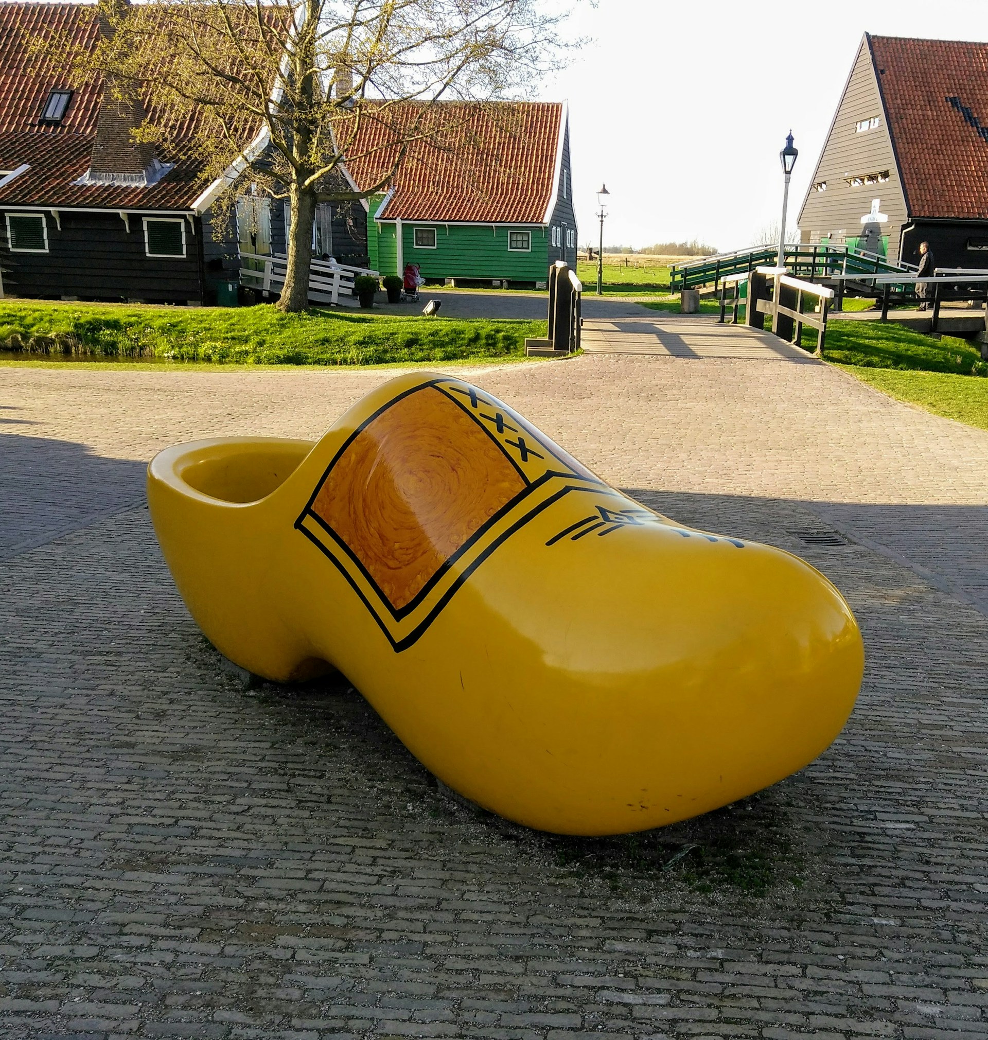 woman wearing yellow long-sleeved dress under white clouds and blue sky during daytime