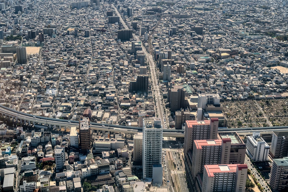 an aerial view of a city with tall buildings