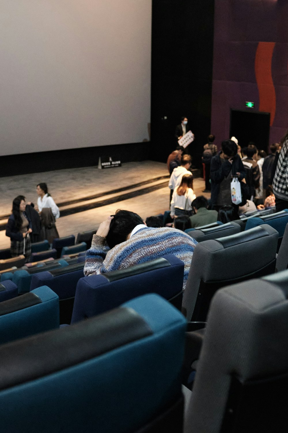 a group of people sitting in a theater