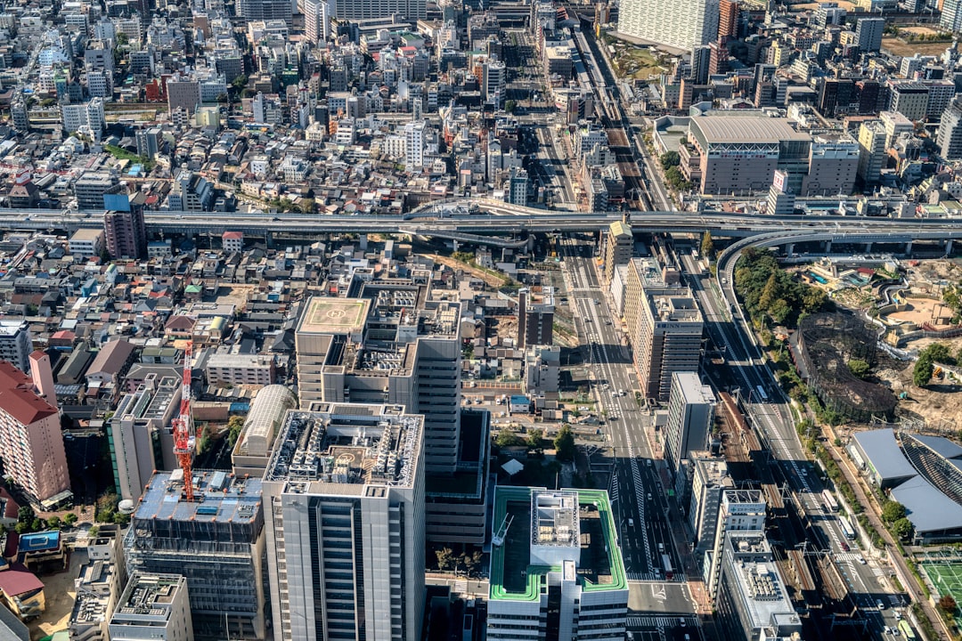 an aerial view of a city with tall buildings,