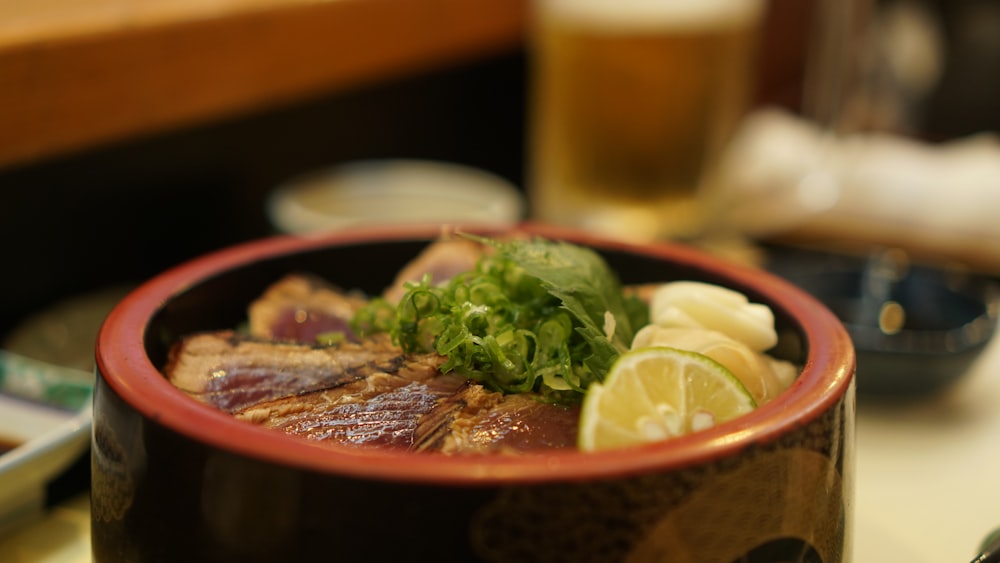 a close up of a bowl of food on a table