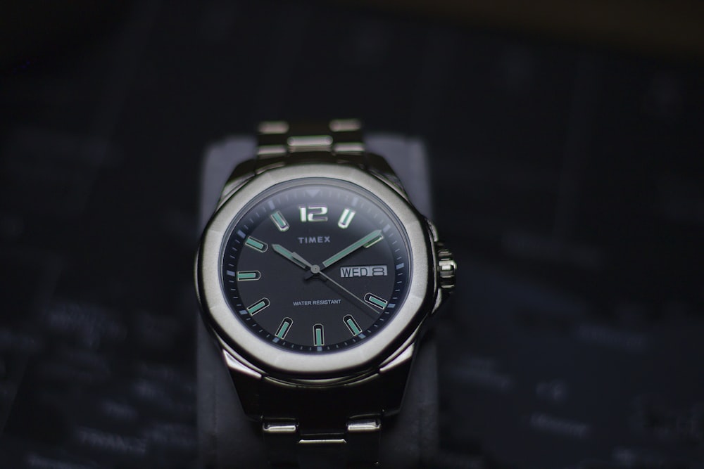 a close up of a watch on a table