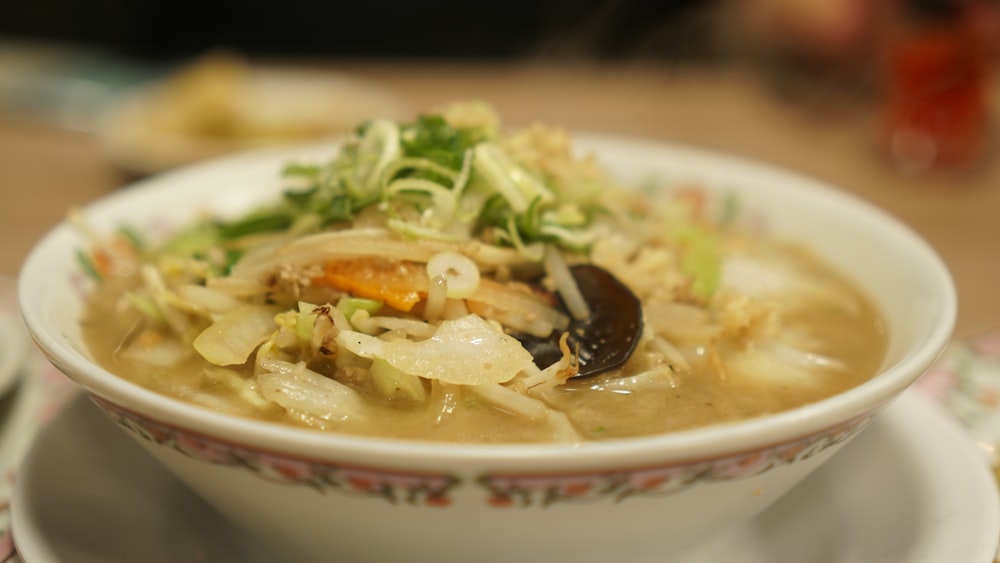 a bowl of soup with a spoon in it