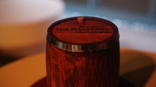 A craftsman inspecting a barrel for quality.