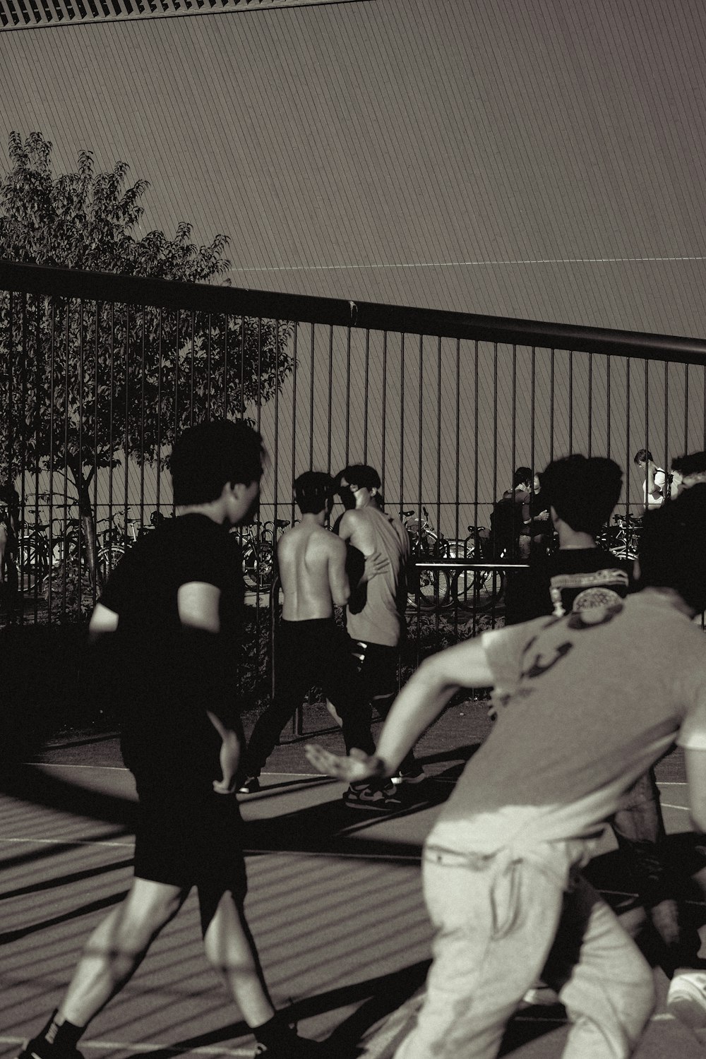 a group of young men playing a game of frisbee