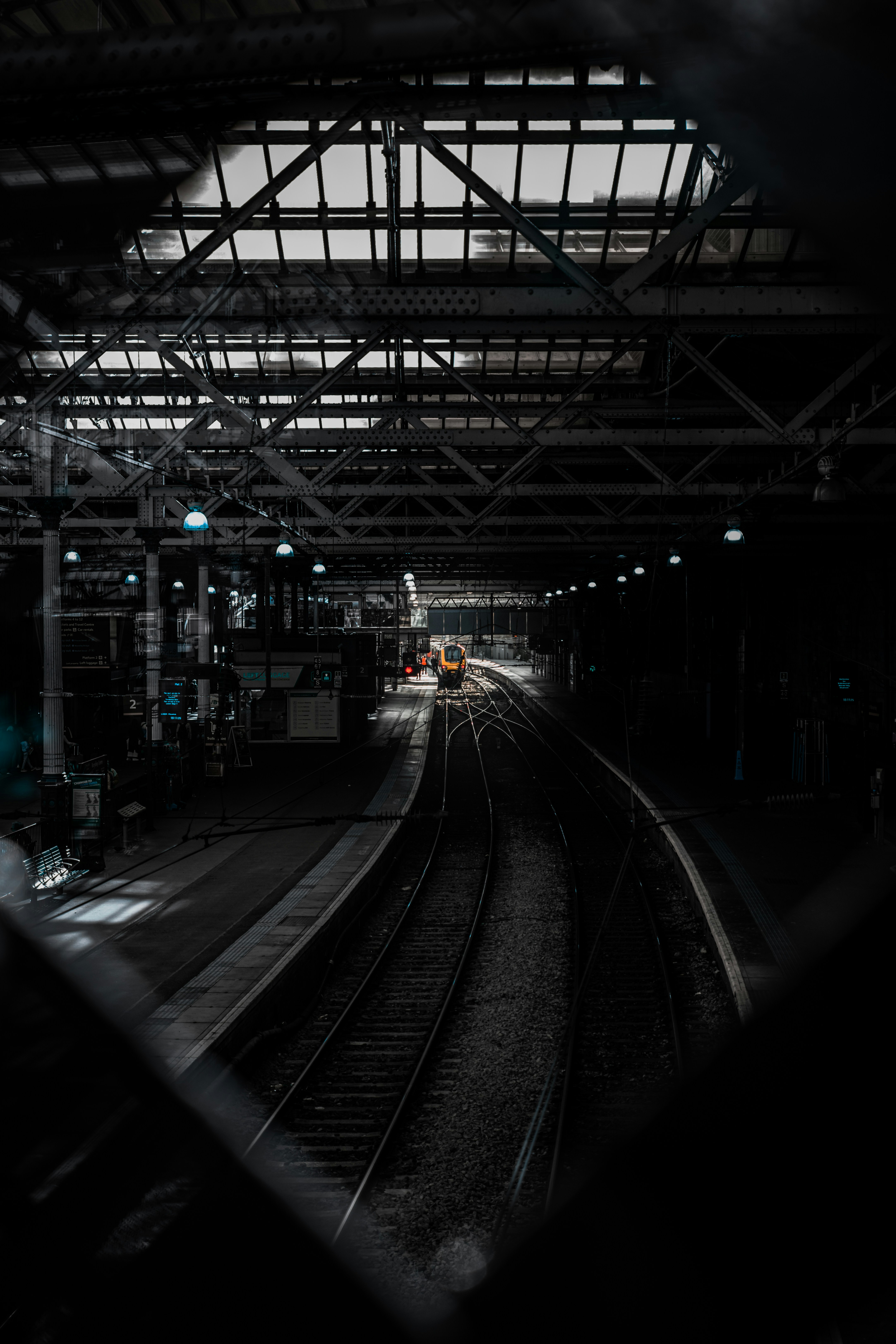 a train station with a train on the tracks