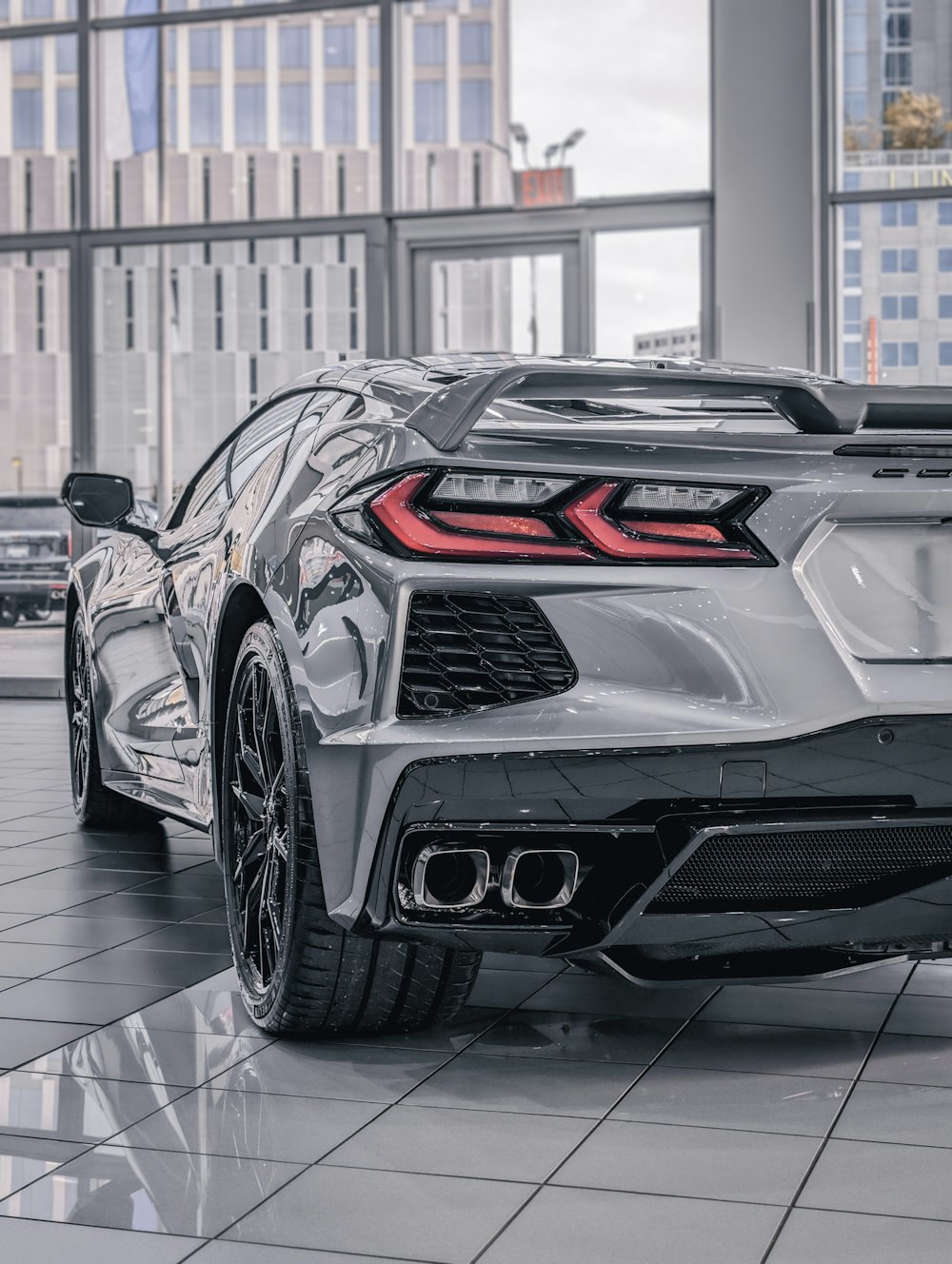 the rear end of a silver sports car