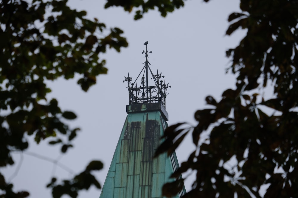 the top of a tall building with a clock on it