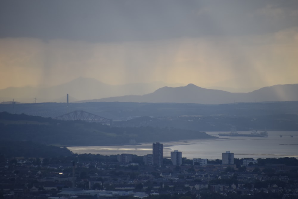 a view of a city with mountains in the background