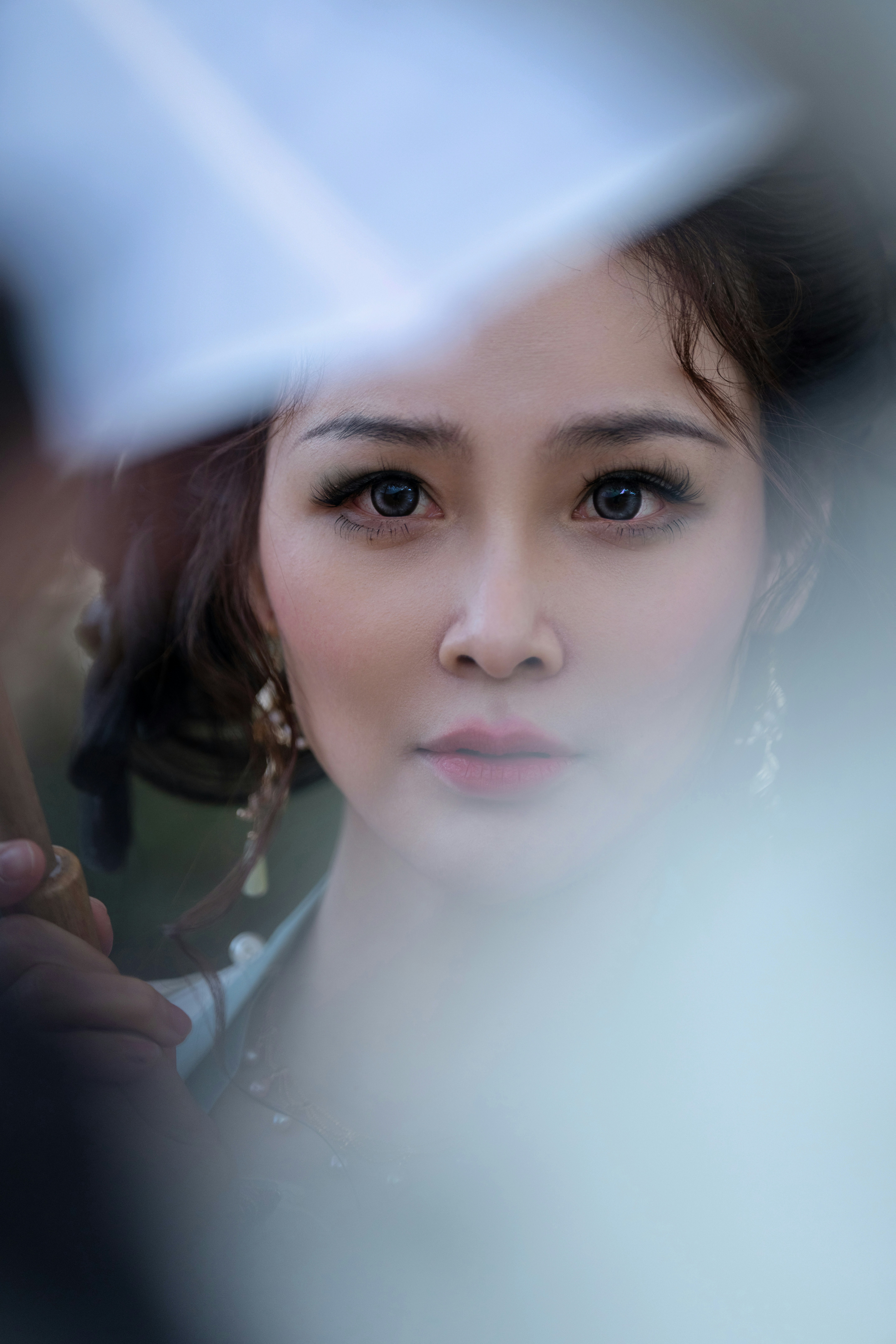 a close up of a person holding an umbrella