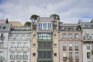 A variety of apartment buildings ranging from small to large, showcasing different architectural styles.