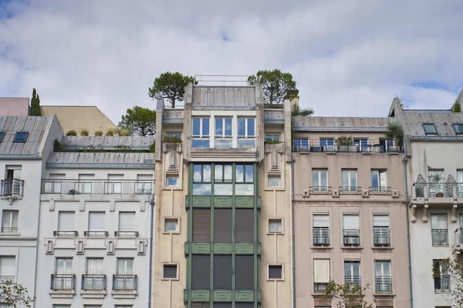 A variety of apartment buildings ranging from small to large, showcasing different architectural styles.