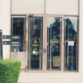 A welcoming office entrance with the socfinanzza logo on the door.