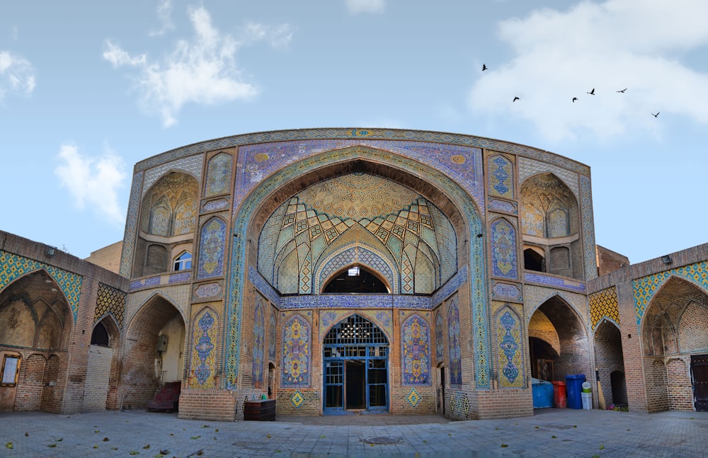 a large ornate building with a sky background