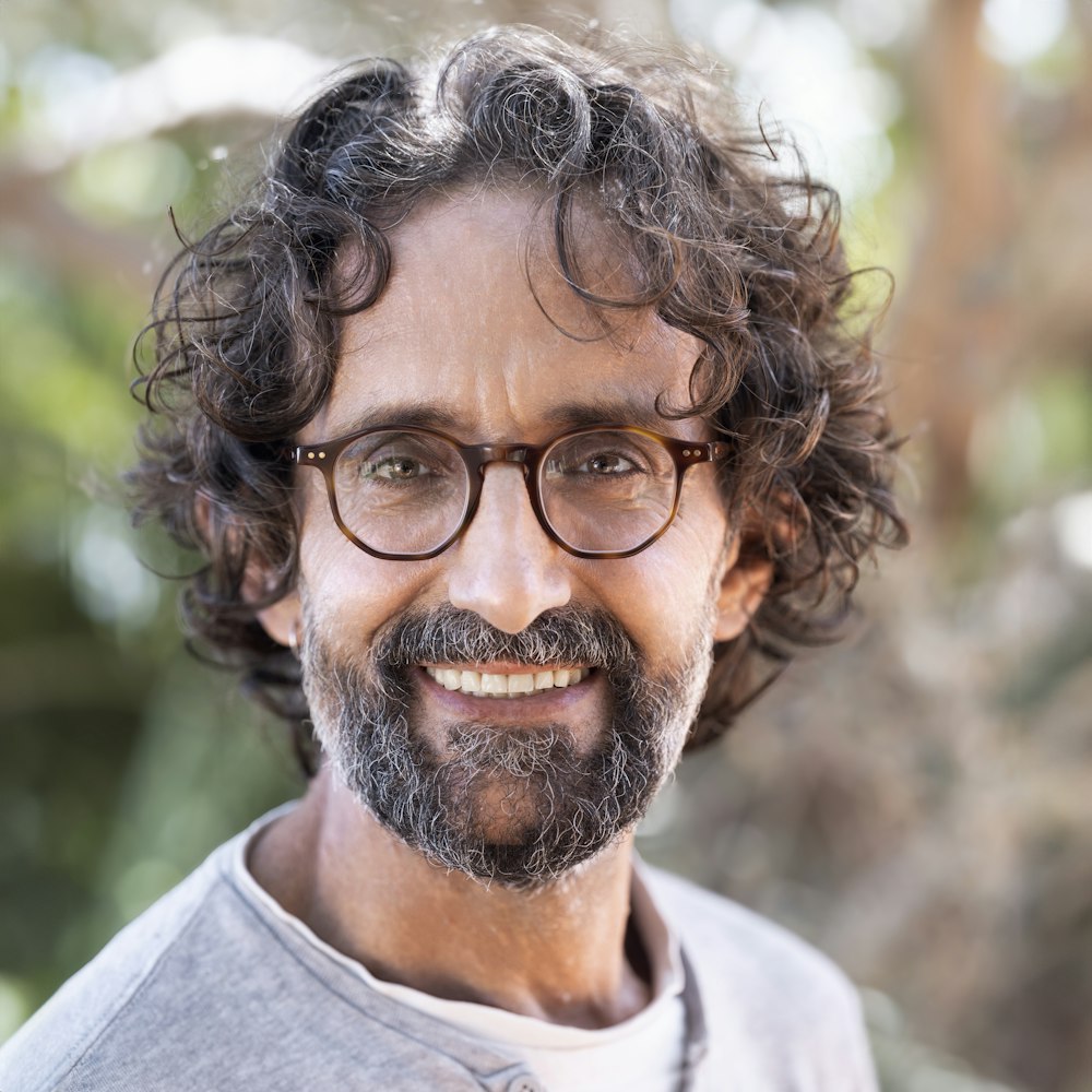 a close up of a person wearing glasses