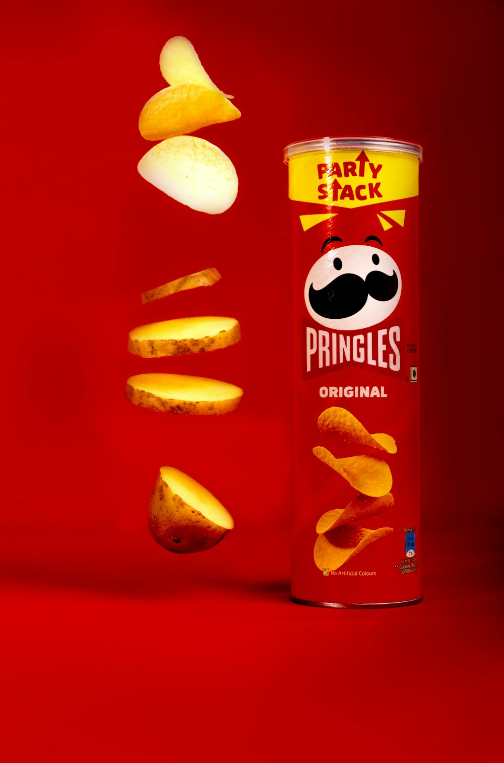 a can of pringles falling into the air