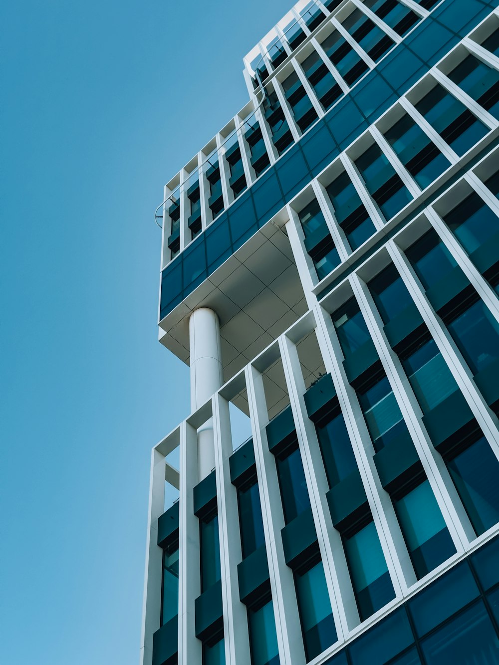 a tall building with a blue sky in the background