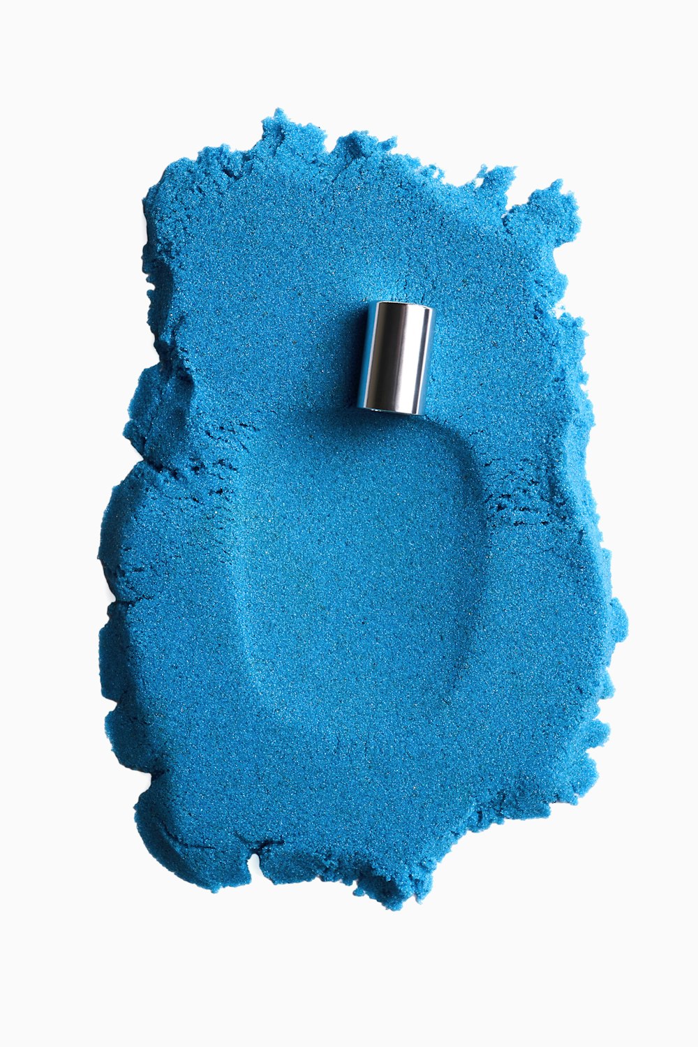 a close up of a blue powdered object