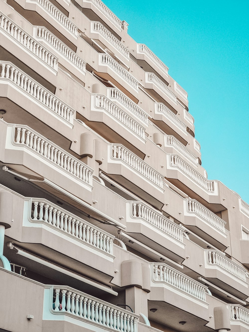 a tall building with balconies and balconies on it