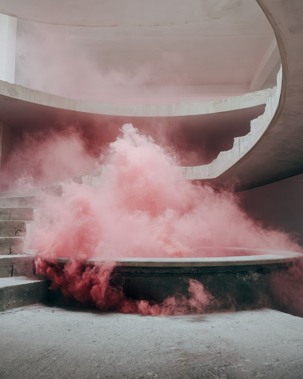 red smoke is coming out of a round bowl