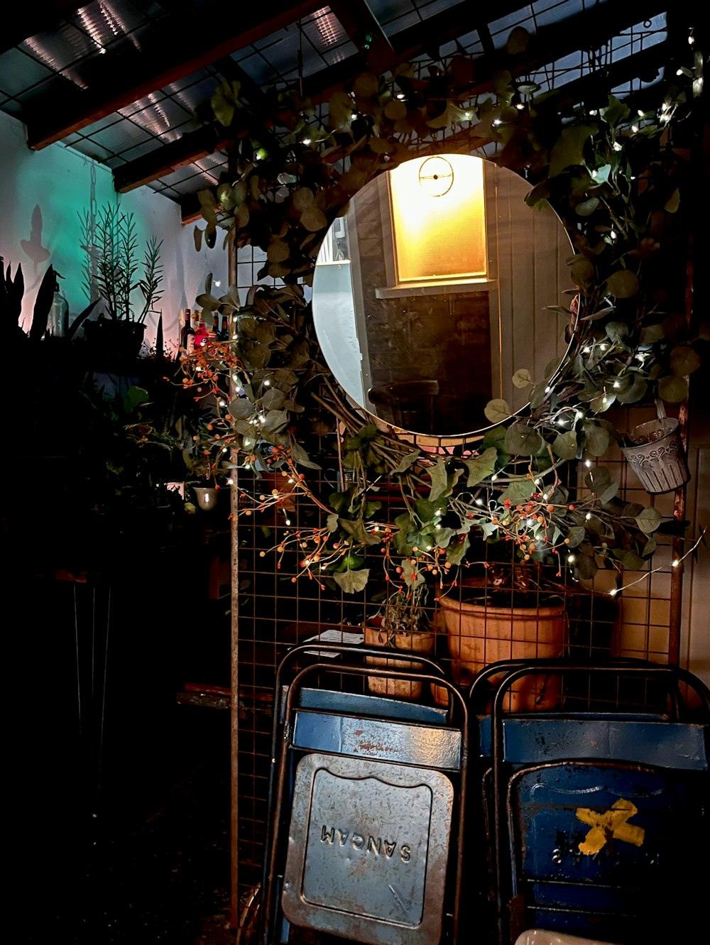 a mirror sitting on top of a metal rack