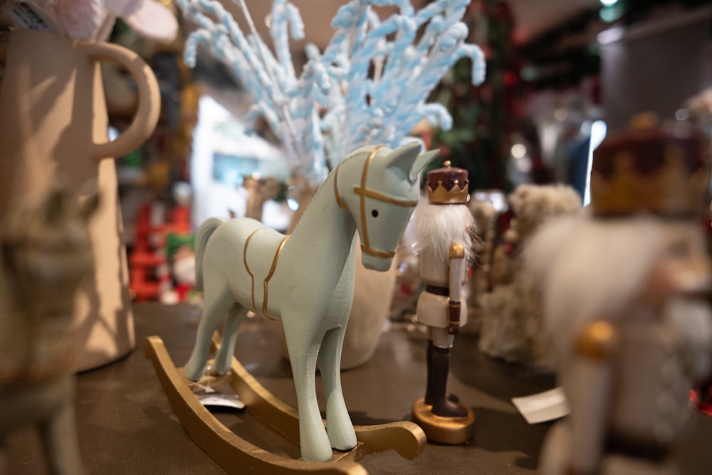 toy figurines of a horse, a man, and a nutcracker