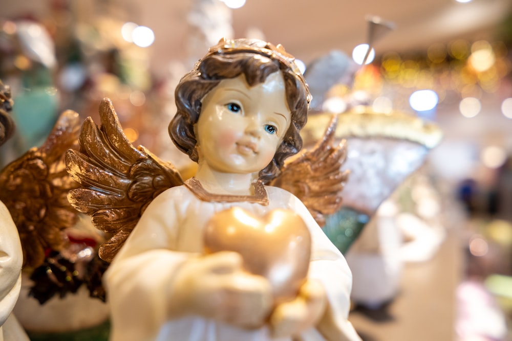 a figurine of an angel holding a heart