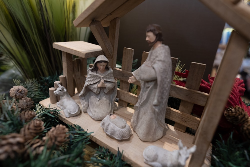 a nativity scene of a manger scene with a baby jesus in a man