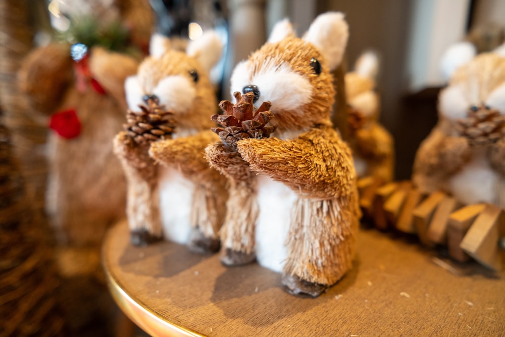 a group of stuffed animals sitting on top of a table