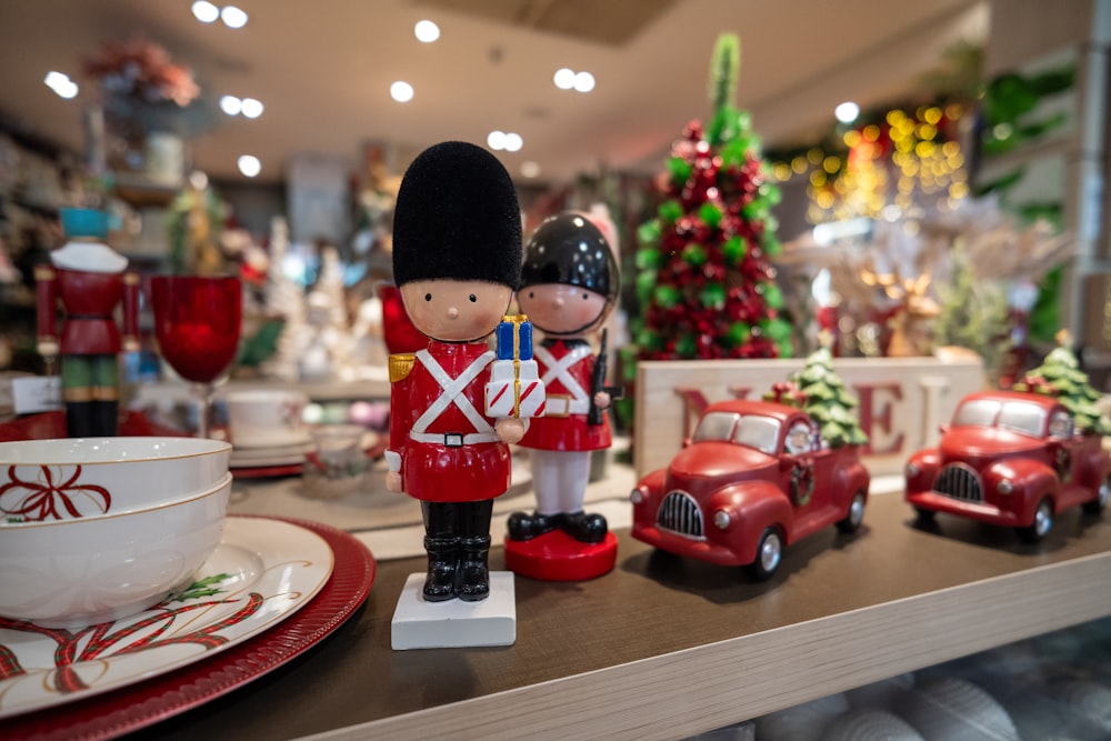 a toy soldier and a toy car on a table